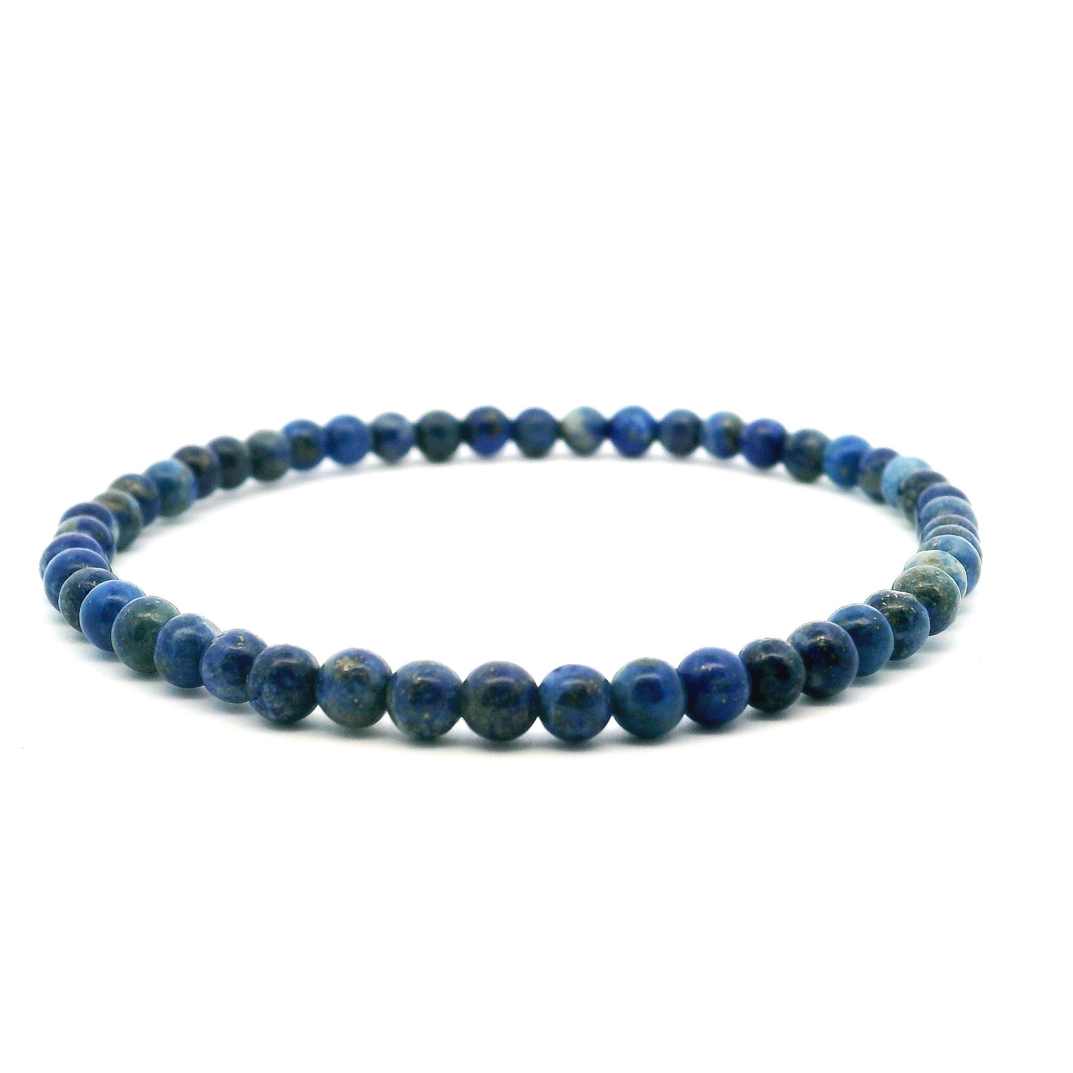 Elevate your style with our Lapis Lazuli Beaded Bracelet, crafted with 4mm smooth round beads in a rich, celestial blue flecked with golden pyrite. Revered as a stone of wisdom, truth, and inner strength, Lapis Lazuli brings a timeless elegance to any ensemble. Strung on a durable, comfortable stretch cord, this bracelet is perfect for layering or wearing solo as a subtle statement. A refined piece for daily wear or meaningful gifting, it embodies both natural beauty and enduring design. Lapis Lazuli Beaded Bracelet - 4mm Rounds