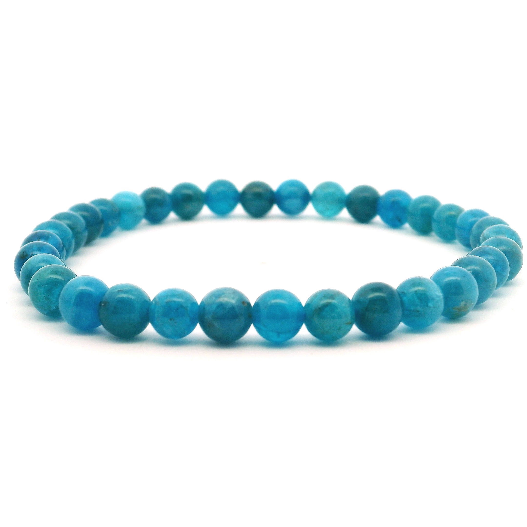 Elevate your style and energy with our Blue Apatite Beaded Bracelet, featuring vibrant 6mm round beads that shimmer in oceanic shades of teal and blue. Known for inspiring clarity, motivation, and honest communication, blue apatite brings both visual allure and empowering energy to your everyday look. Hand-strung on a durable stretch cord for a comfortable, flexible fit, this bracelet layers effortlessly or stands out beautifully on its own. A meaningful piece for personal growth and expression, it’s a striking and versatile addition to any jewelry collection. Blue Apatite Beaded Bracelet - 6mm