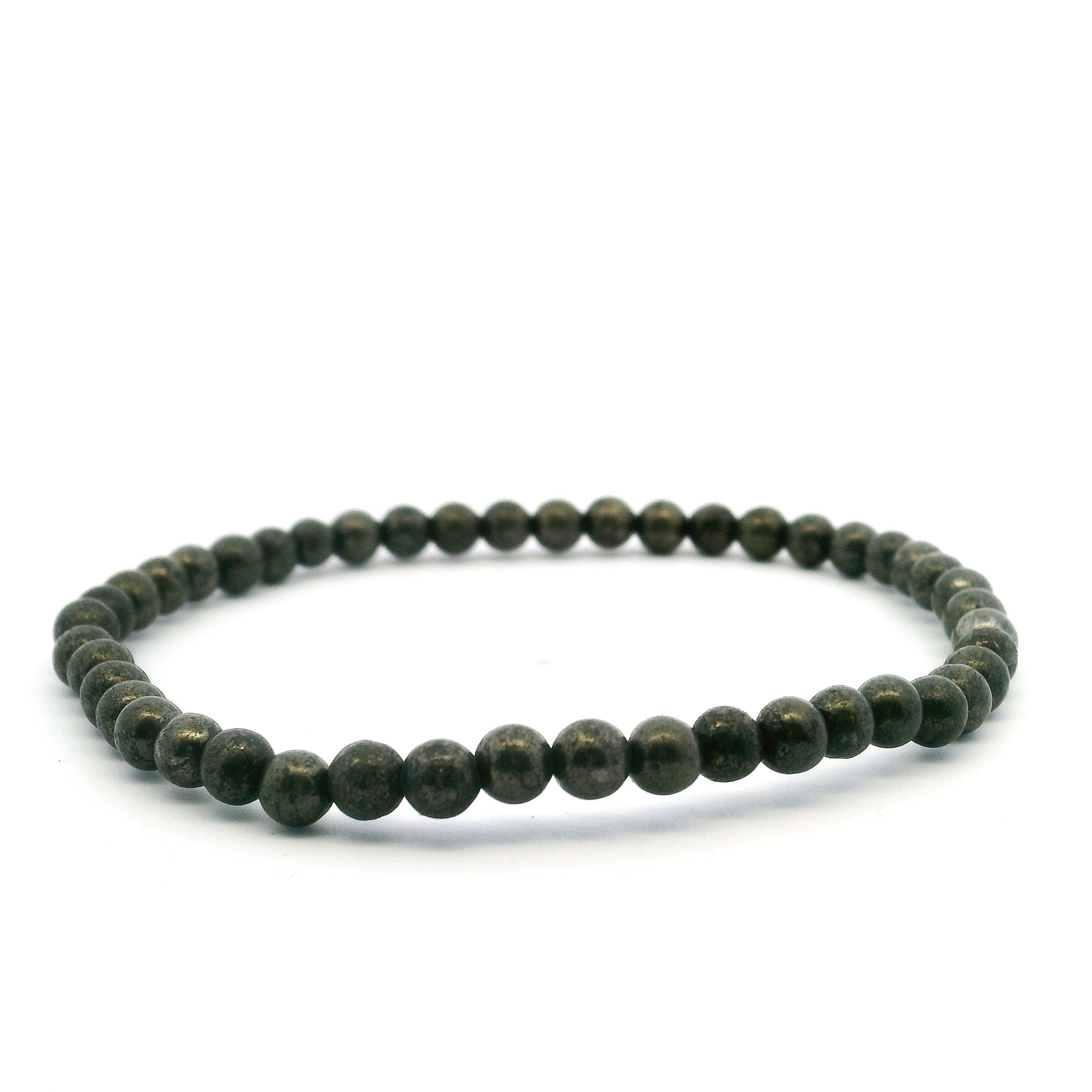 Elevate your style with our Pyrite Beaded Bracelet, showcasing shimmering 4mm round beads that capture the stone’s iconic metallic glow. Known as “Fool’s Gold,” pyrite radiates confidence and protective energy, making this bracelet both a stylish and meaningful addition to any collection. Expertly hand-strung for comfort and durability, it effortlessly enhances casual or elegant looks—perfect worn alone or layered for a bold, sophisticated statement. Pyrite Beaded Bracelet - 4mm Rounds