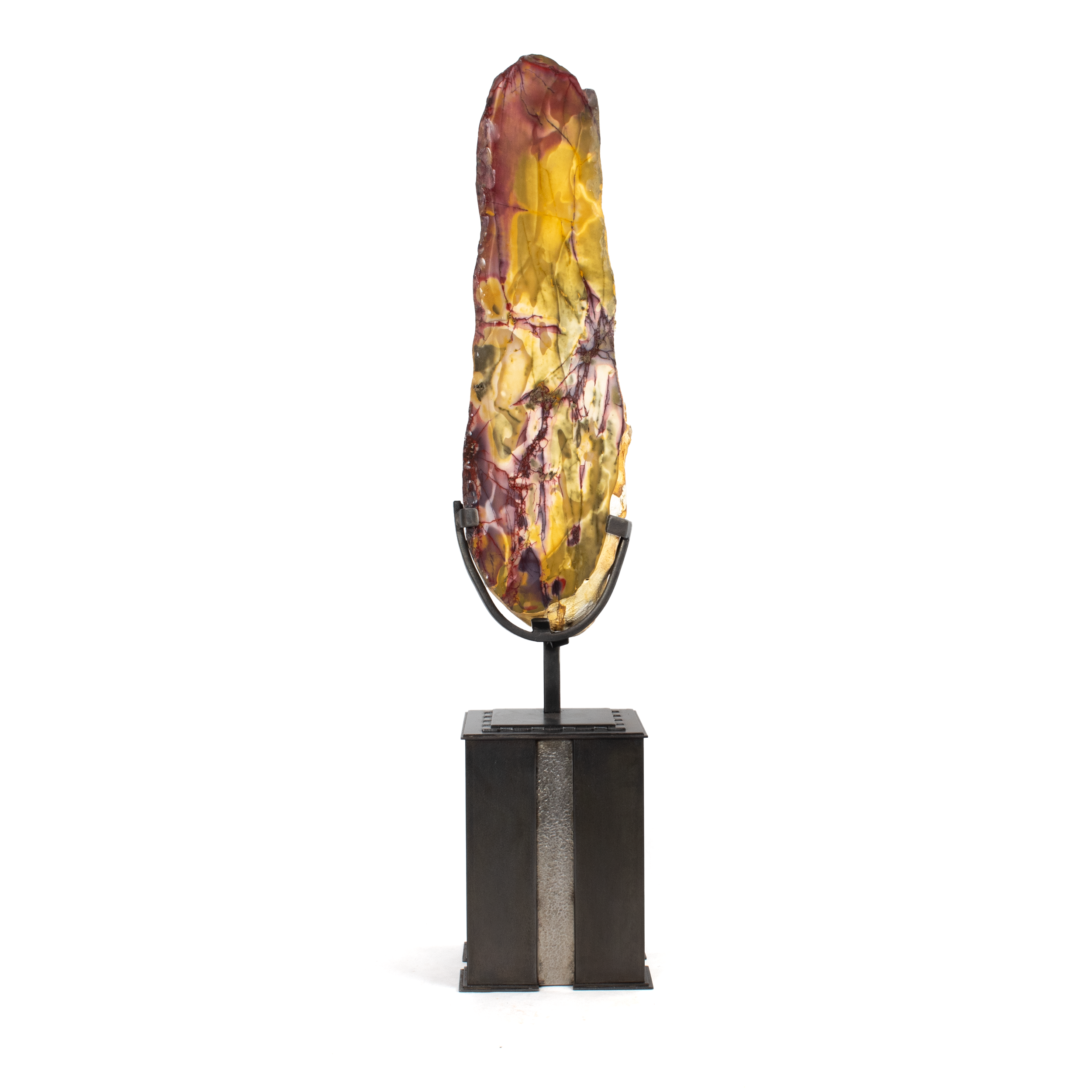 Elevate your space with this striking Mookaite End Cut, displayed on a custom-designed Art Deco stand. Rich with earthy reds, golden ochres, and creamy neutrals, the elongated slab highlights the bold, painterly patterns that make Mookaite so distinctive. A minimalist square base with polished copper accents grounds the piece in a clean, sculptural aesthetic, offering a refined contrast to the organic form above. Both timeless and modern, this one-of-a-kind display is perfect for collectors, interior designers, or anyone seeking a commanding mineral centerpiece that fuses natural beauty with artisan craftsmanship. Mookaite End Cut on Custom Design Art Deco Stand - Elongated on Square Base