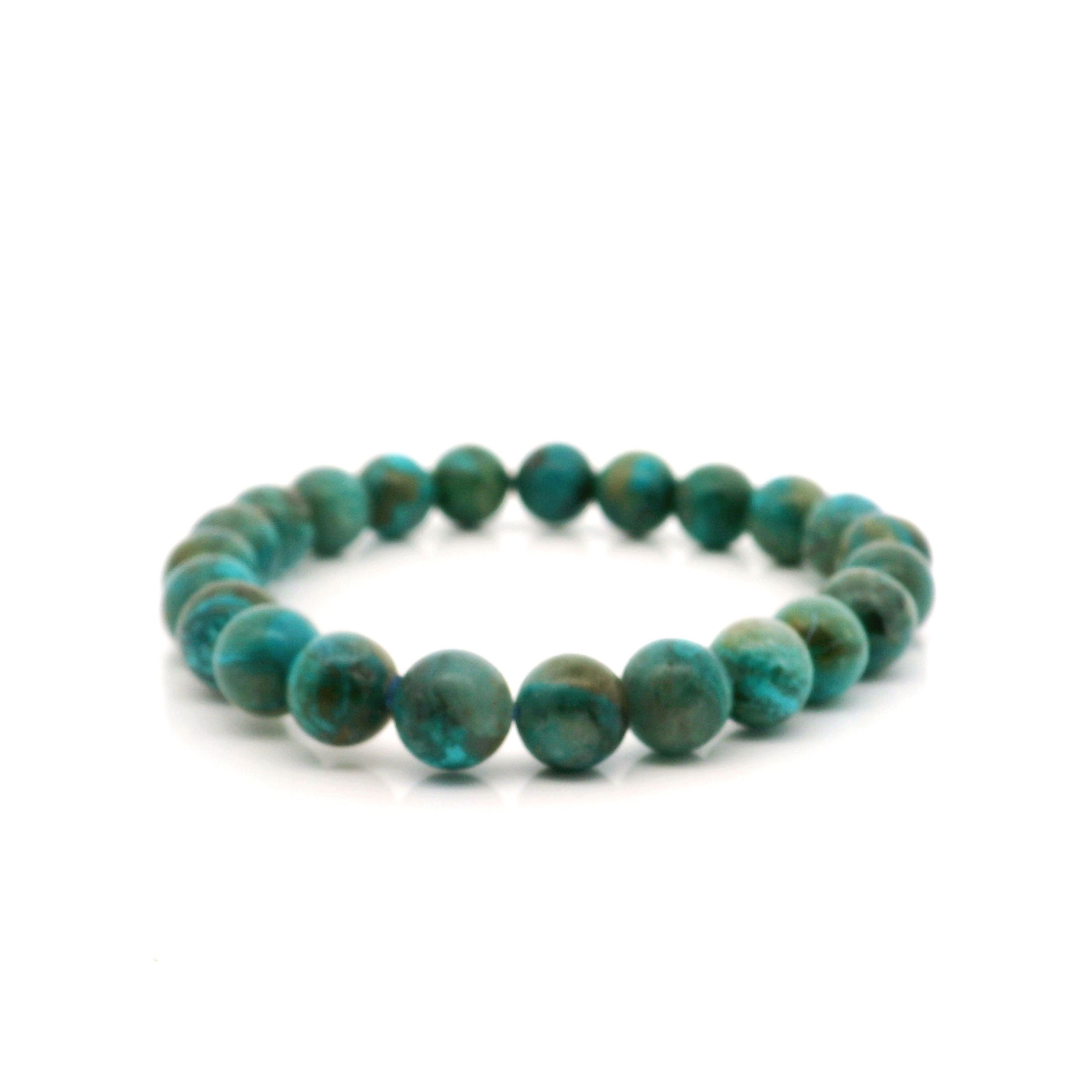 Embrace tranquility and natural beauty with our Chrysocolla Beaded Bracelet, featuring polished 8mm round beads strung on a durable, stretchy cord for a comfortable fit. Known for its soothing blues and greens, each chrysocolla bead offers unique patterns, making every bracelet truly one-of-a-kind. Perfect for stacking or wearing solo, this bracelet effortlessly complements any outfit while inviting calm, creativity, and inner balance into your day. Handcrafted and designed for both men and women, it's a meaningful gift or a special treat for yourself. Chrysocolla Beaded Bracelet - 8mm Rounds