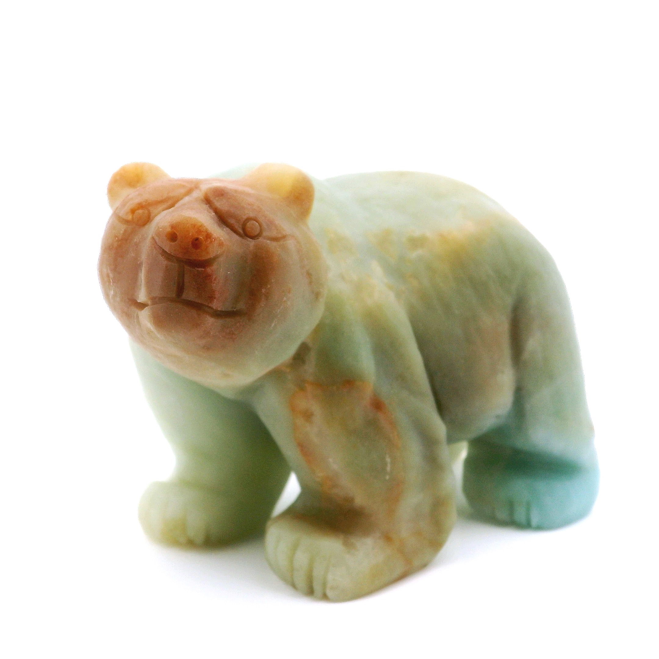 Bring calming energy and natural beauty to your space with this exquisite Amazonite Bear Carving. Handcrafted from genuine amazonite stone, each bear sculpture features unique patterns and soothing hues of blue-green, making it a meaningful and eye-catching accent for your home or office. Symbolizing courage, protection, and harmony, this charming bear makes a thoughtful gift for loved ones or a special addition to your crystal collection. Amazonite Bear Carving