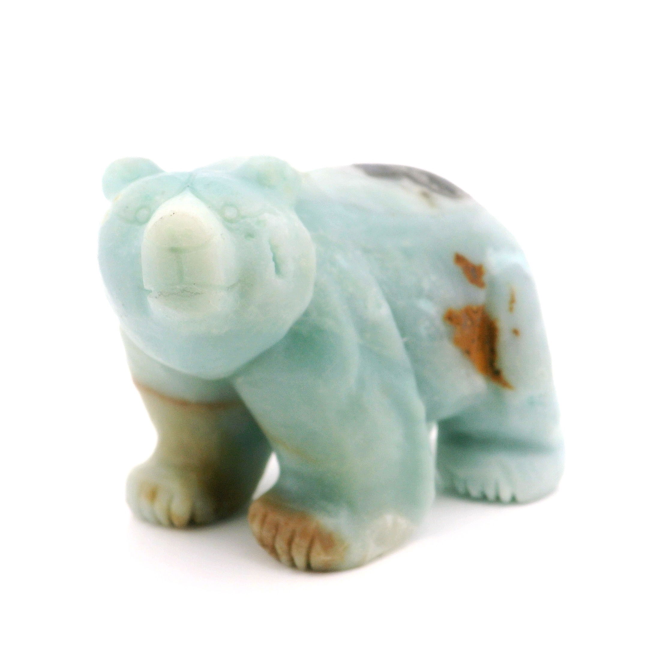 Embrace the gentle energy of our Amazonite Bear Carving—a handcrafted sculpture that combines artistry with the soothing power of natural crystal. Expertly carved from genuine Amazonite, each bear showcases tranquil shades of blue-green, symbolizing courage and harmony. Perfect as a thoughtful gift, unique décor piece, or addition to your crystal collection, this bear invites balance and positive vibes into any space. Amazonite Bear Carving