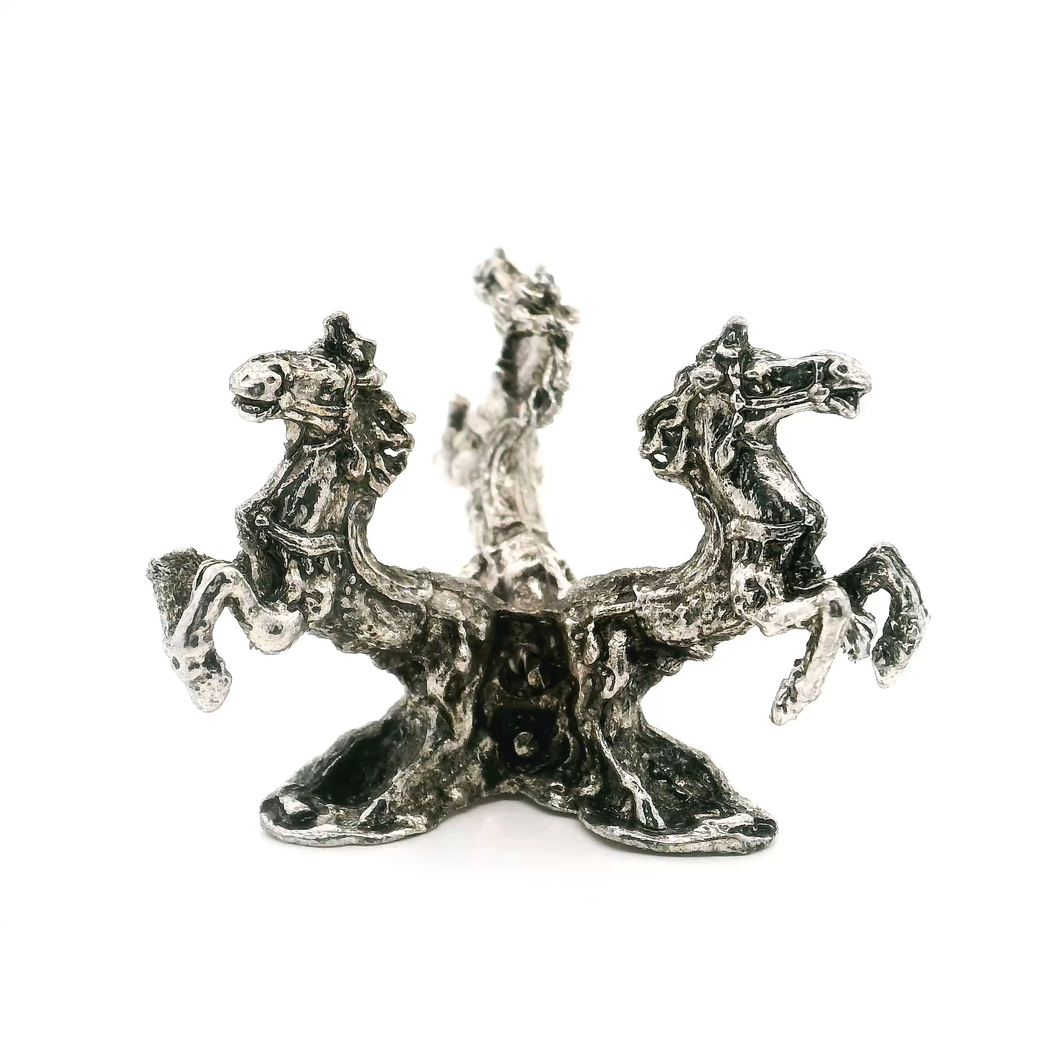 Elevate your treasured crystal spheres or decorative orbs with our Casted Base Metal 3 Horses Sphere Stand in a stunning silver finish. Expertly crafted from durable metal, this unique stand features three elegantly detailed horses encircling the base, symbolizing strength and grace. The intricate design not only provides stable support for your favorite spheres but also adds a touch of sophistication to any desk, shelf, or display case. Casted Base Metal 3 Horses Sphere Stand - Silver