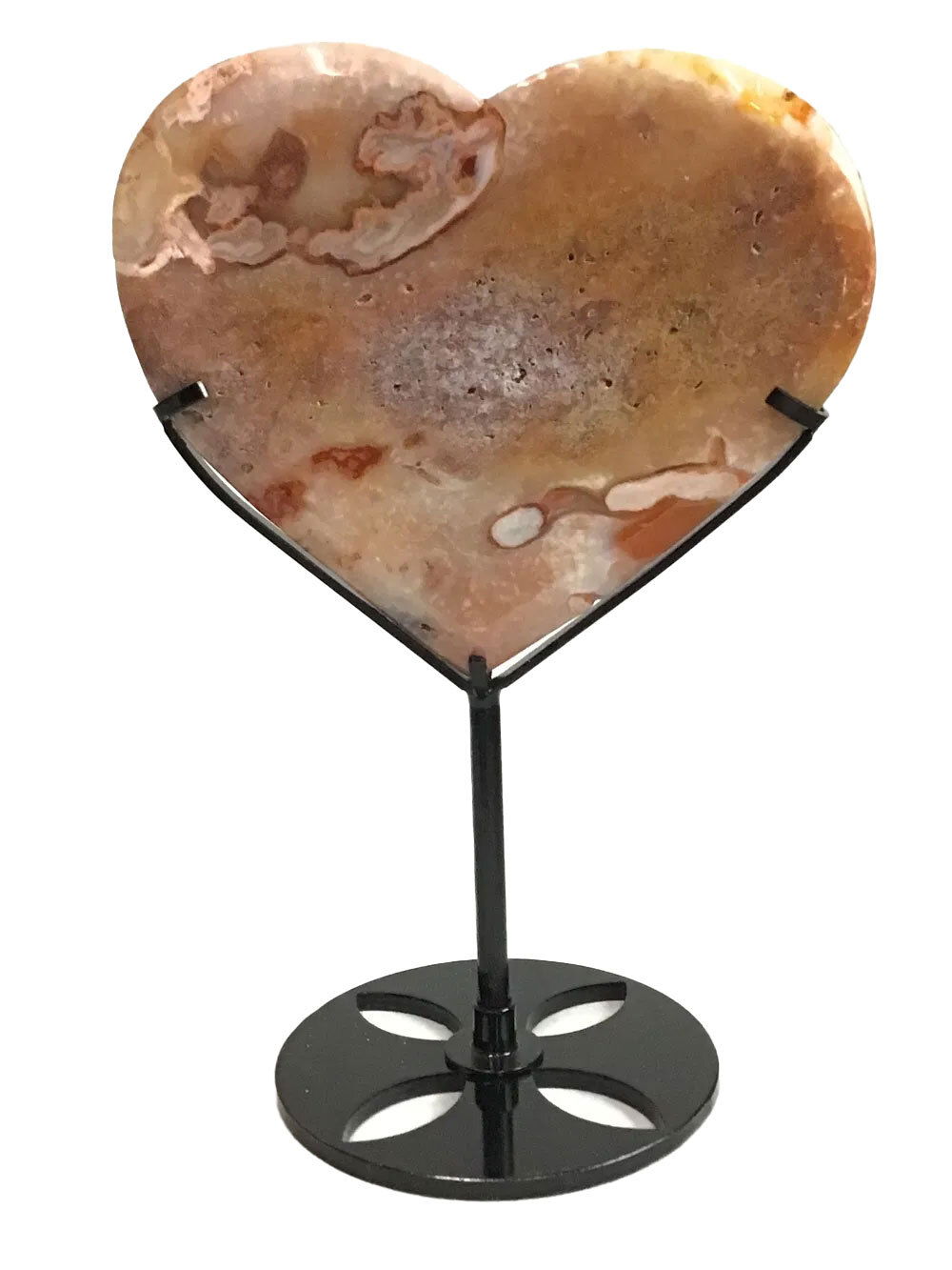 Bring vibrant energy and natural beauty to any space with our Flower Carnelian Heart on a Fitted Metal Stand. This stunning piece features a peach-orange opaque carnelian heart, uniquely adorned with a horizontal lavender riverbed pattern that flows gracefully across the crystal. Geometric shapes and subtle heart motifs dance through the natural mineral, blending earthy warmth with delicate artistry. Perfect for collectors and decor enthusiasts alike, this carnelian heart radiates grounding energy and creativity, making it an eye-catching statement in your crystal or mineral collection. Flower Carnelian Heart on Fitted Metal Stand - Peach Orange Opaque Color with Horizontal Lavendar Riverbed Pattern