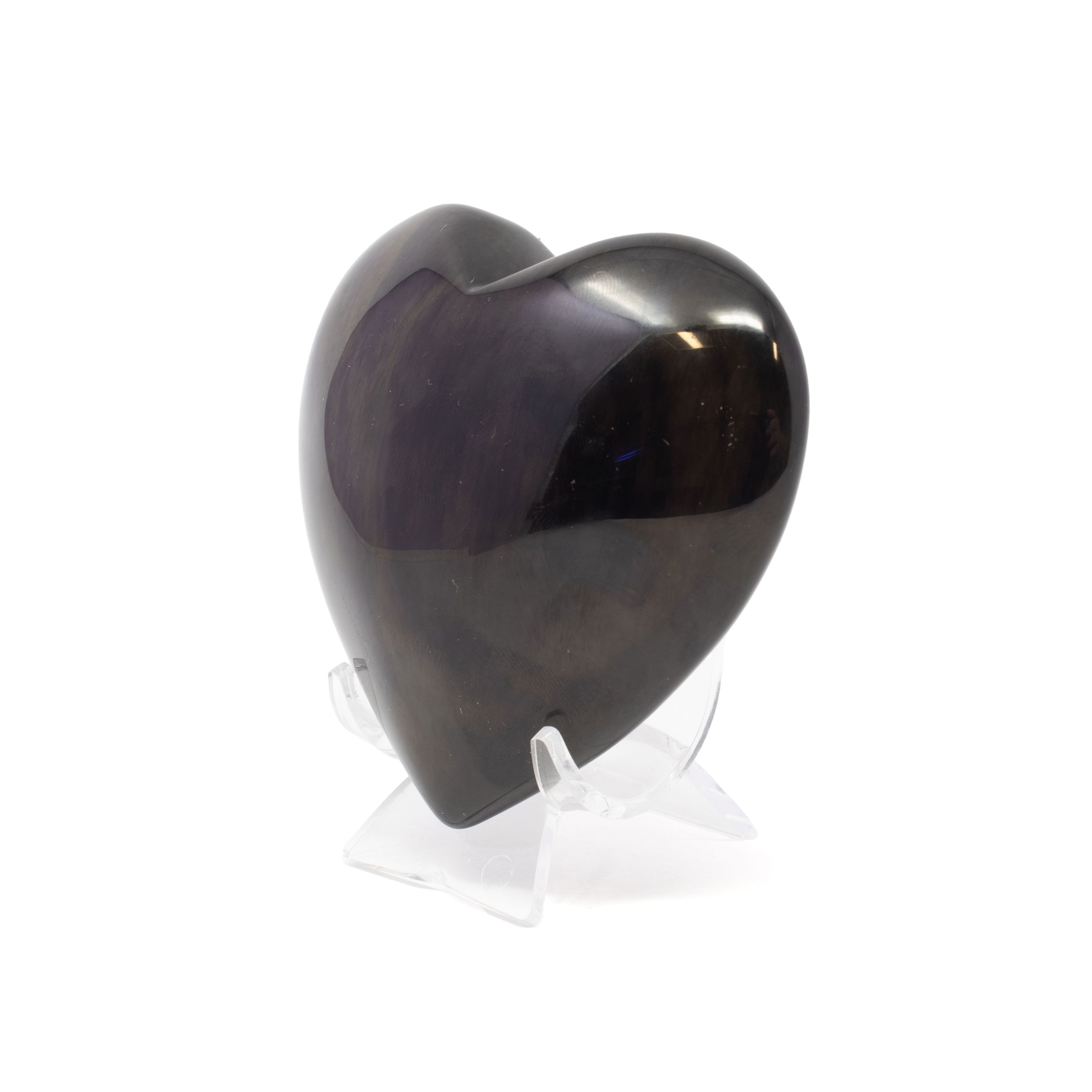 Elevate your space with the mesmerizing beauty of the Rainbow Obsidian Heart on a Lucite Stand. Each heart is expertly carved from high-quality rainbow obsidian, revealing captivating flashes of iridescent colors beneath its polished surface. Resting securely on a sleek lucite stand, this geometric heart adds a modern, elegant touch to any decor. Renowned for its protective and healing properties, rainbow obsidian is prized by crystal enthusiasts for grounding energy and promoting emotional balance. Rainbow Obsidian Heart on Lucite Stand