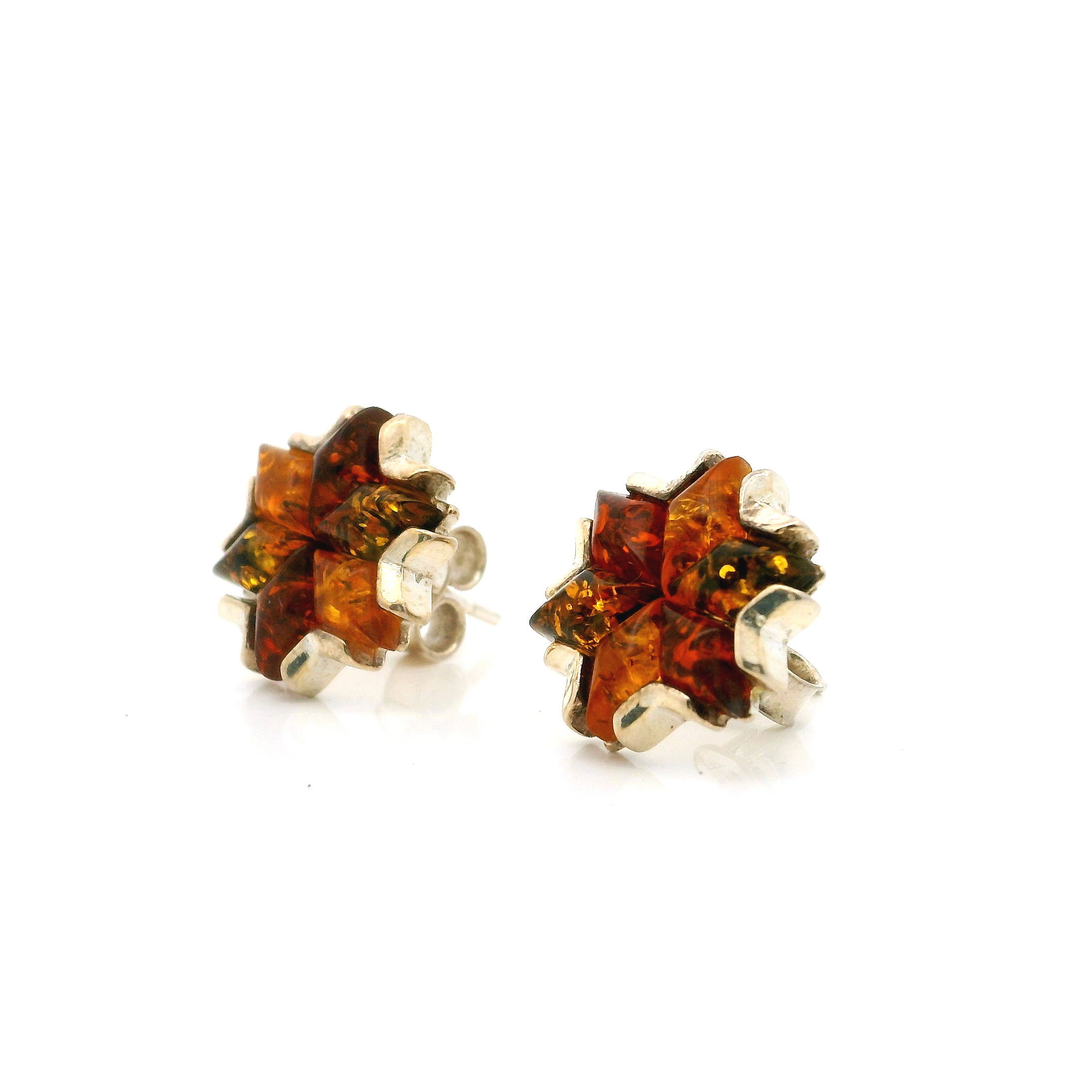 Illuminate your style with our Multi Amber Stud Earrings, featuring a striking quad-color palette of hand-selected Baltic ambers in warm honey, cherry, lemon, and green hues. Set in polished 925 sterling silver, the unique angular design brings a modern edge to classic gemstone beauty. Lightweight and comfortable for everyday wear, these stud earrings offer effortless sophistication—perfect for elevating any outfit or gifting a touch of timeless elegance. Multi Amber Stud Earrings - Classic Quad Colors with Angular Design