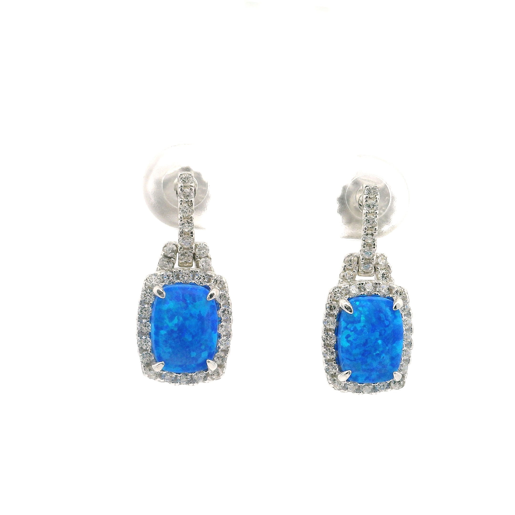 Elevate your elegance with these Blue Opal Earrings, masterfully crafted in 925 sterling silver. Each earring showcases a striking rectangular blue opal cabochon, its vibrant hues captured in a secure post setting. Surrounding the opal and accenting the graceful bail, a halo of sparkling white CZs adds sophisticated brilliance, reminiscent of Swarovski crystals. Blue Opal Earrings on Post - Rectangle Cabochon with White CZs in Bail & Surrounding Prong Setting in 925 Sterling Silver