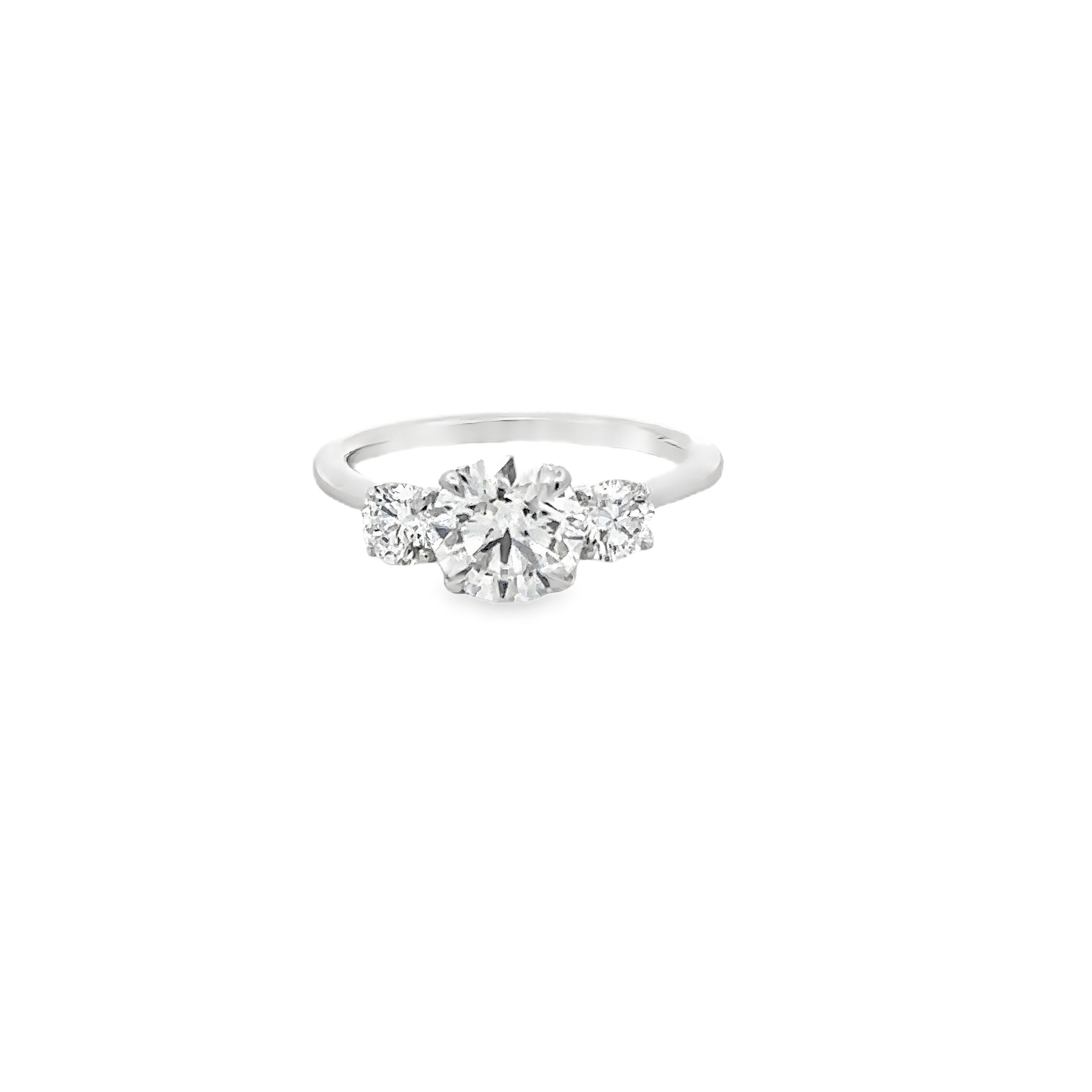 Celebrate your love with this exquisite 18K White Gold 3-Stone Engagement Ring, featuring a dazzling 1.52 carat G/SI1 GIA-certified round brilliant diamond (GIA #2235274892) as the centerpiece. Flanked by two sparkling round brilliant side diamonds totaling 0.54 carats (GH/SI1), the classic design is timelessly elegant, radiating brilliance from every angle. Perfectly crafted for a lifetime of cherished memories, this stunning ring is a testament to enduring love and exceptional craftsmanship. 18KWG 1.52CT G/SI1 GIA#2235274892 ROUND BRILLIANT & 2 BR DIAMONDS 0.54CT GH/SI1 3-STONE RING