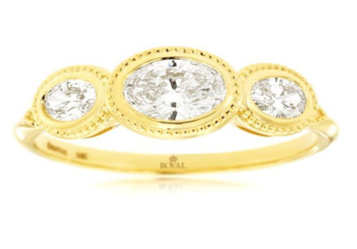 Celebrate your love with this exquisite 14K yellow gold engagement ring, featuring three stunning oval diamonds totaling 0.70 carats. Each diamond is elegantly secured in a sleek bezel setting, creating a modern yet timeless look. The trio of sparkling stones symbolizes your past, present, and future together, making this ring a meaningful choice for your special commitment. Sophisticated and radiant, this three-stone ring is the perfect blend of classic beauty and contemporary style. 14KYG 3 OVAL DIAMONDS 0.70CT BEZEL SET 3-STONE RING