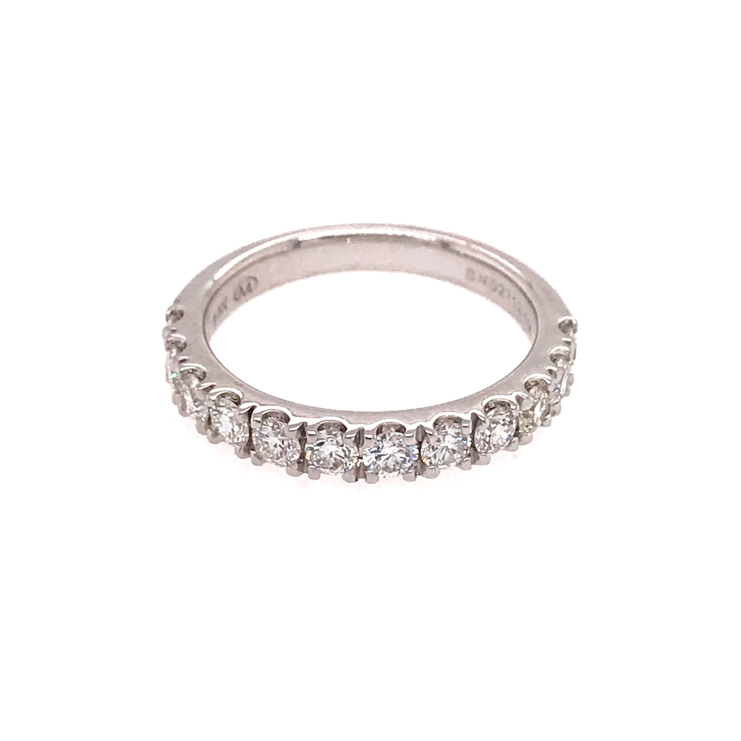 Celebrate everlasting love with this exquisite 14K white gold women's wedding band, beautifully adorned with 12 round brilliant diamonds totaling 1.00 carat. Each diamond is expertly set to deliver maximum sparkle and timeless elegance, making this ring the perfect symbol of your commitment. The classic design blends sophistication and modern charm, ensuring it pairs flawlessly with any engagement ring or stands brilliantly on its own. Crafted for lasting beauty and everyday wear, this diamond wedding band is a stunning reminder of your most treasured moments. 14K WG 12 BR DIA'S 1.00CT WEDDING BAND