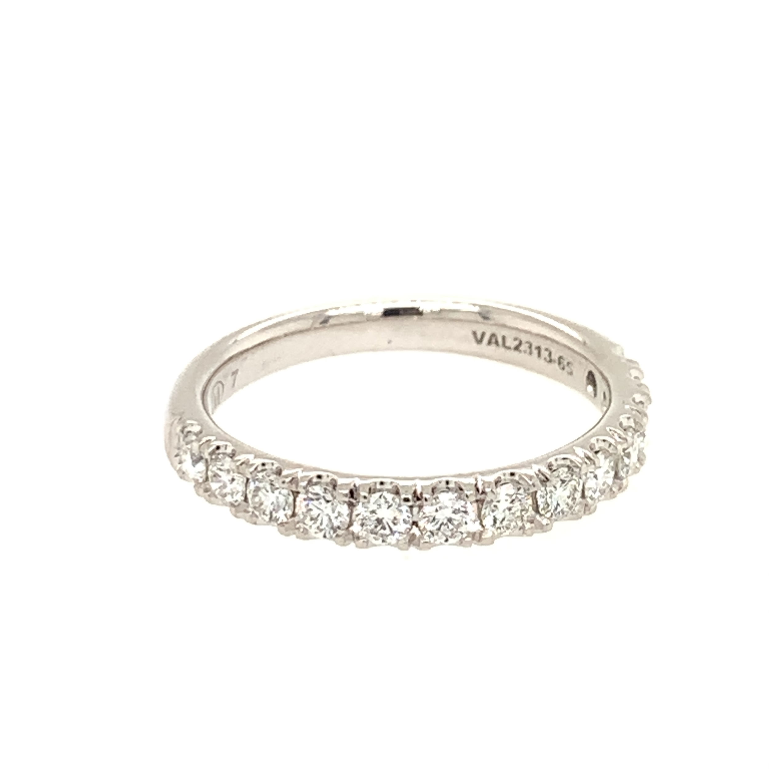 Celebrate eternal love with this exquisite 14K White Gold Wedding Band, shimmering with 13 brilliant round diamonds totaling 0.65 carats. Each diamond is expertly set in a sleek straight prong design, maximizing sparkle and elegance. The lustrous white gold and classic silhouette make this women's diamond wedding band a timeless symbol of commitment—perfect for wearing alone or stacking with your engagement ring. Meticulously crafted for lasting beauty, this ring shines with sophistication on your special day and every day after. 14K WG 13 BR DIAMONDS 0.65CT STRAGHT PRONG WEDDING BAND