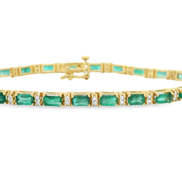 14K YELLOW GOLD TENNIS BRACELET WITH 23 EMERALDS @ 7.30CT & 46 ROUND DIAMONDS @ 0.46CT