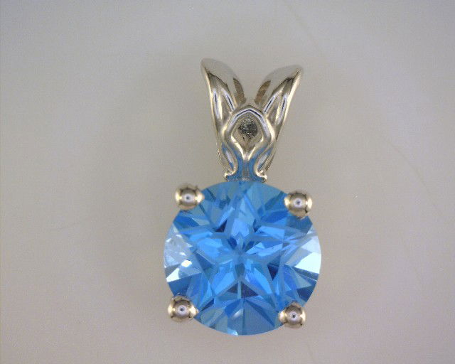 14KWG 12MM TEXAS STAR CUT BLUE TOPAZ SCROLL DROP PENDANT 14KWG 12MM TEXAS STAR CUT BLUE TOPAZ SCROLL DROP PENDANT