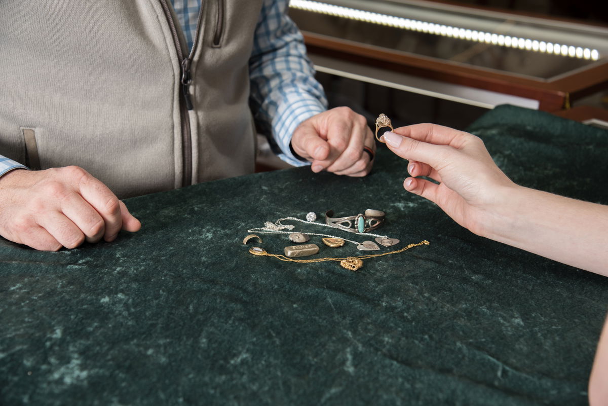 Gold jewelry pieces being weighed and assessed for their value at Thacker Jewelry