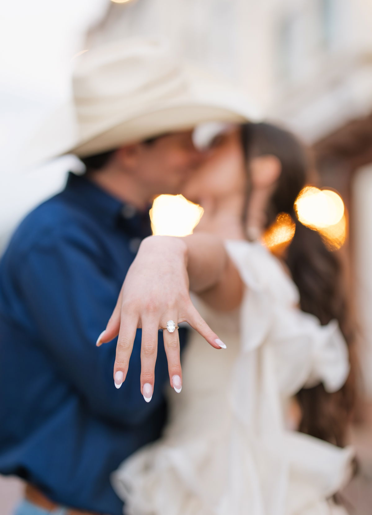 Couple admiring engagement rings at Thacker Fine Jewelry showroom