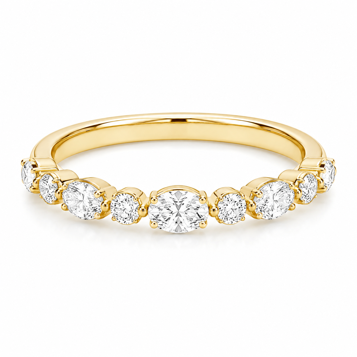 Madi's wedding band in yellow gold with round diamonds.