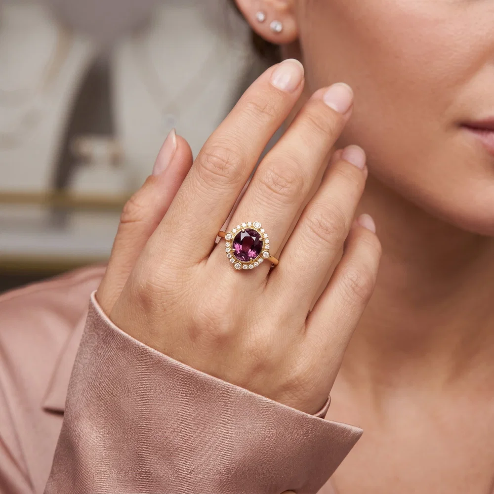 Rich vivid pink spinel gemstone ring with diamond halo