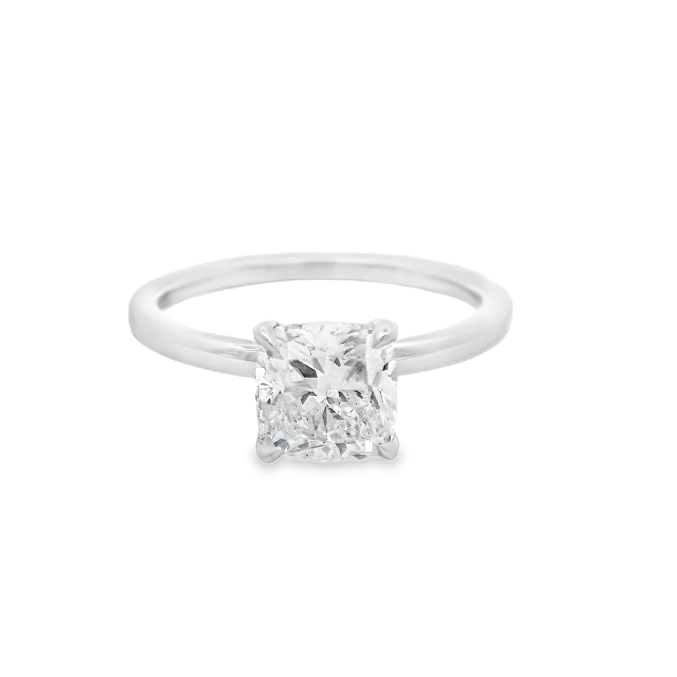 Celebrate your love with this exquisite 18K white gold solitaire engagement ring, featuring a stunning 1.50-carat cushion modified brilliant diamond. Certified by GIA (GIA# 7392025007), the diamond boasts a captivating H color and SI1 clarity, radiating remarkable brilliance and fire. The timeless solitaire setting in gleaming 18K white gold perfectly showcases the stone’s elegant proportions and romantic silhouette. Make a lasting impression with a classic yet distinctive ring designed to be treasured for a lifetime. 18K wg 1.50ct H/SI1 GIA#7392025007 Cushion Cut Diamond Solitaire Engagement Ring