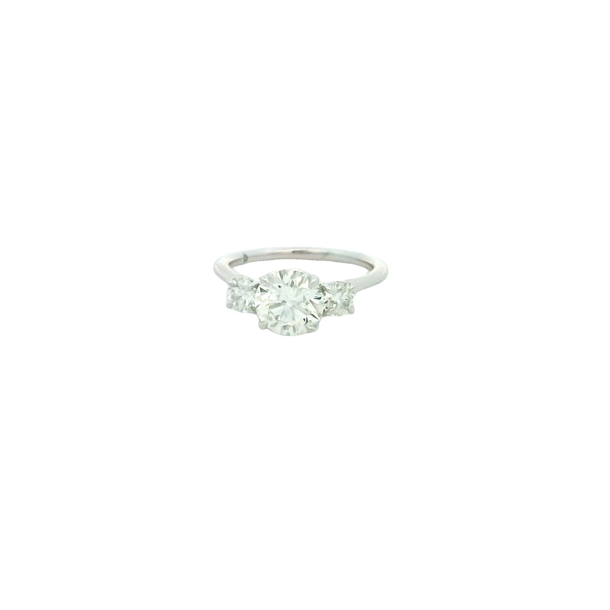 Celebrate your love with this stunning 18K white gold three-stone diamond engagement ring. Featuring a breathtaking 1.51 carat round brilliant diamond center (graded I/SI1, GIA certified #6495872605) and accented by two sparkling round brilliant diamonds totaling 0.50 carats (J/SI2), this elegant ring radiates timeless beauty and brilliance. Meticulously crafted to display exceptional fire and sparkle, it’s the perfect symbol of your forever commitment. Make your proposal unforgettable with this exquisite diamond masterpiece. 18KWG 1.51CT I/SI1 GIA#6495872605 BR DIA & 2 BR DIA'S 0.50CT J/SI2 3-STONE RING