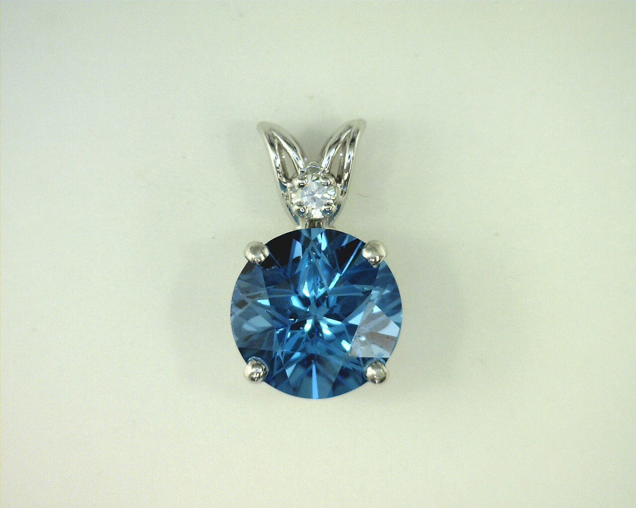 STERLING SILVER 8MM TEXAS STAR CUT BLUE TOPAZ SCROLL PENDANT STERLING SILVER 8MM TEXAS STAR CUT BLUE TOPAZ SCROLL PENDANT