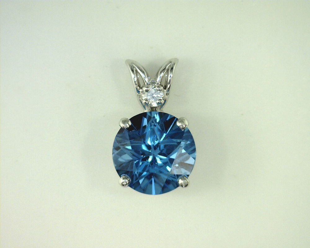 STERLING SILVER 7MM TEXAS STAR CUT BLUE TOPAZ SCROLL PENDANT STERLING SILVER 7MM TEXAS STAR CUT BLUE TOPAZ SCROLL PENDANT