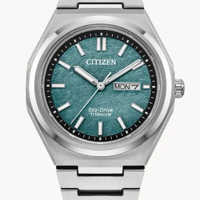 CITIZEN ECO-DRIVE SUPER TITANIUM WATCH W/GREEN DIAL -- DAY/DATE