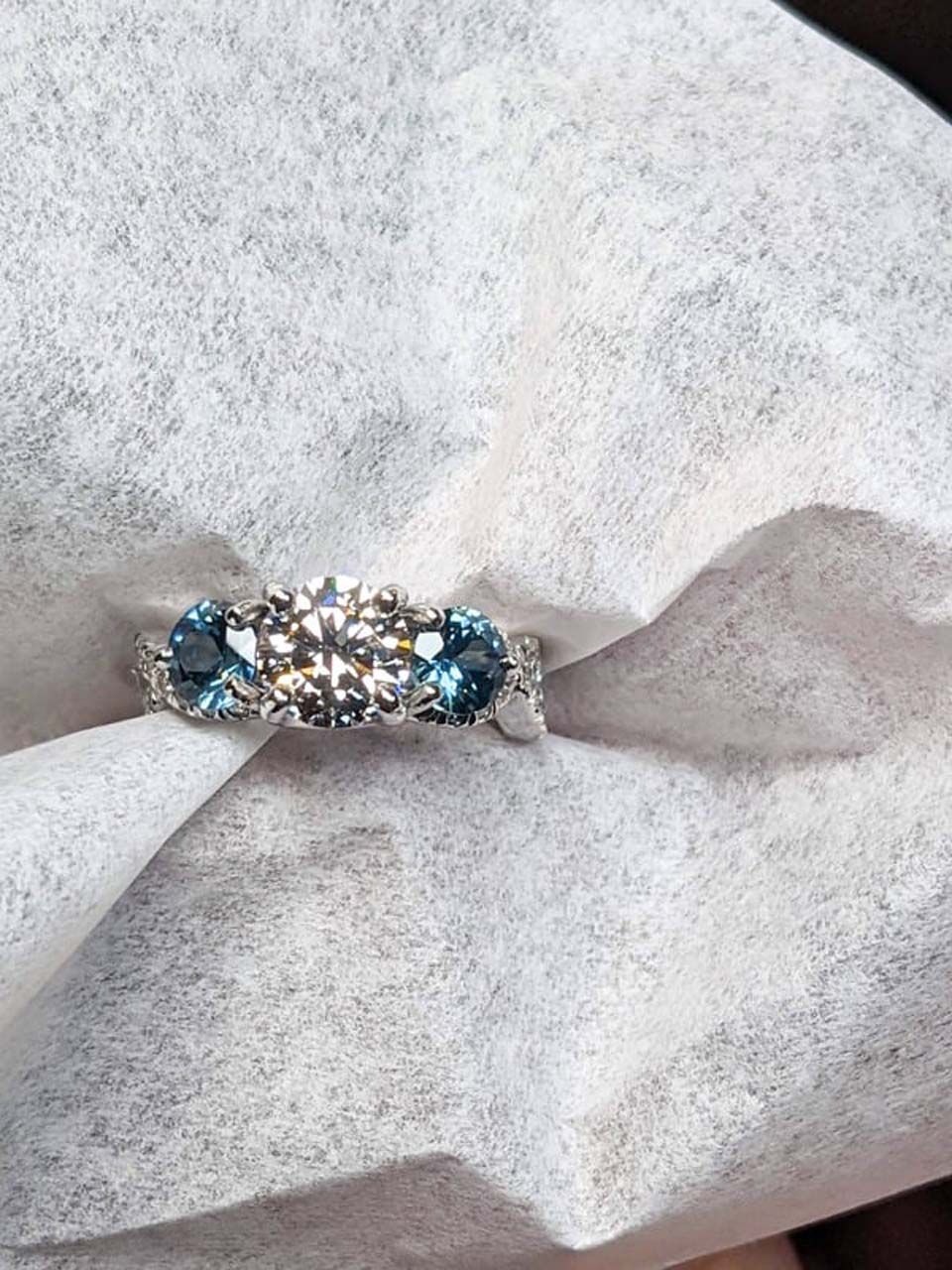 A close up of a ring on a piece of paper