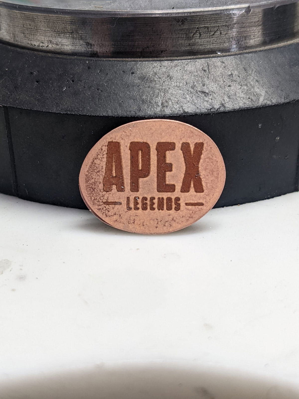 A brown circle with apex legends written on it
