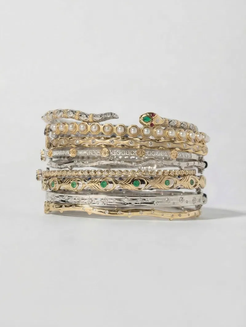 Stacked gold bracelets and bangles