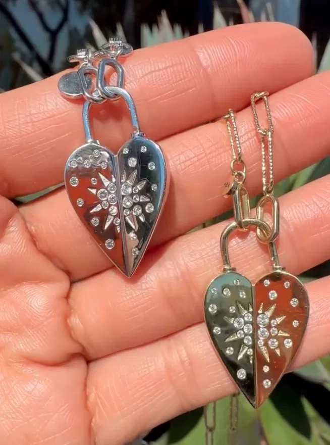 14k gold jewelry with diamonds and colored gemstones arranged on a soft neutral surface