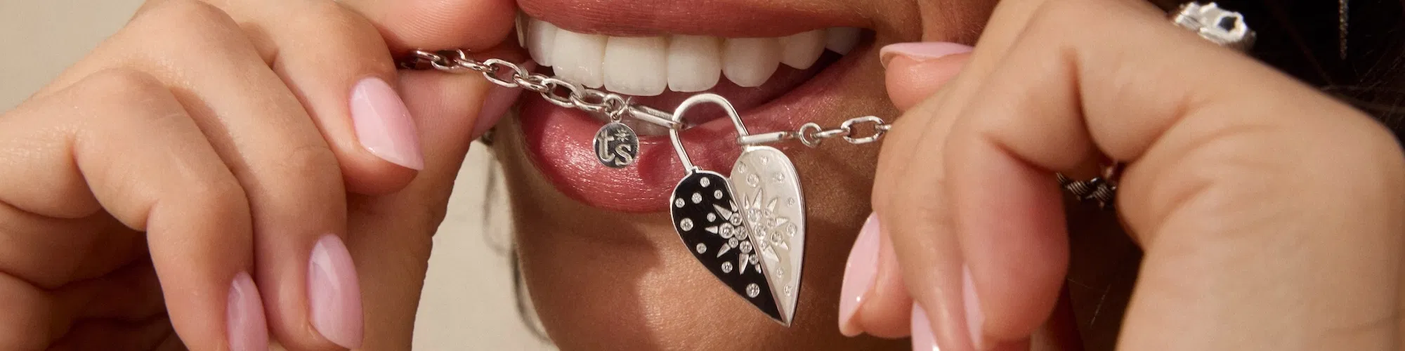 Hand-crafted Three Stories sterling silver jewelry with diamond accents on neutral linen