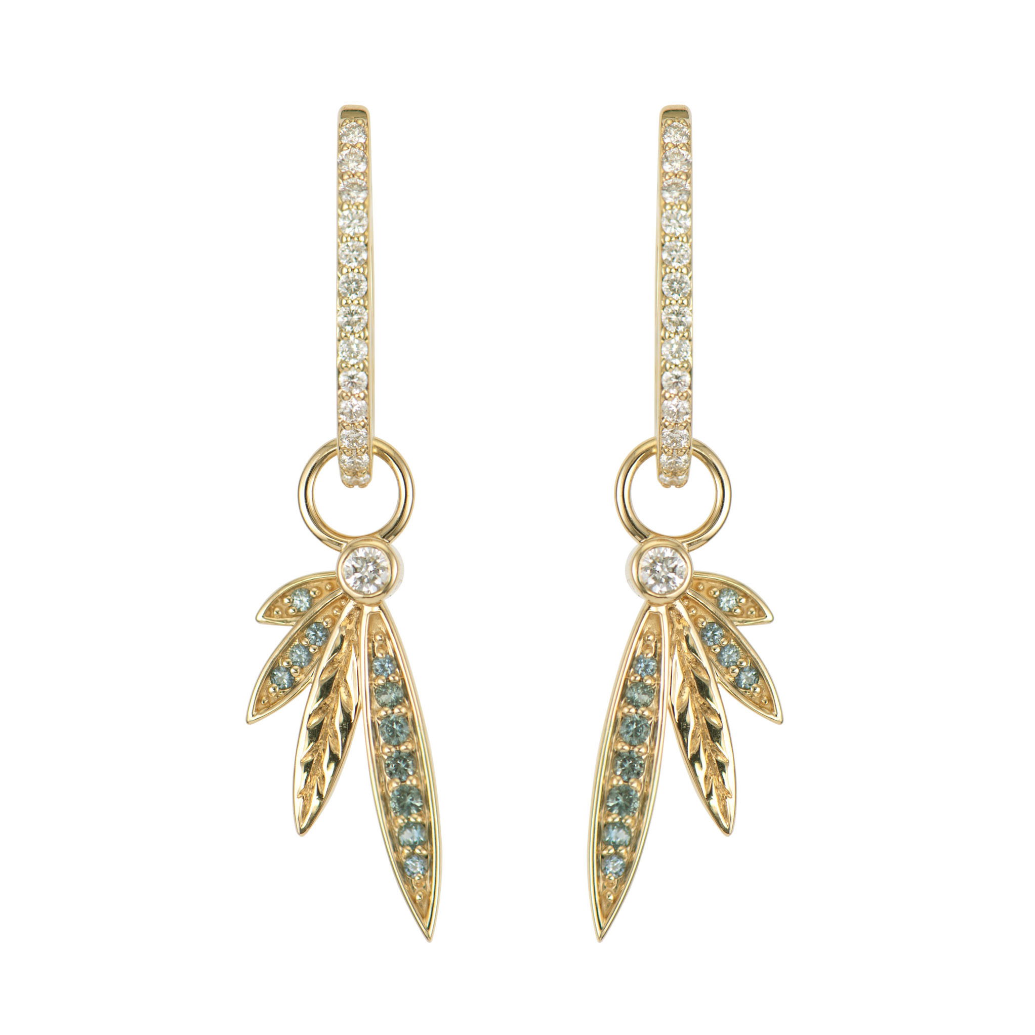 This Ombre Open Wing Sapphire Charm captures the celestial beauty of an unfurled wing in 14K yellow gold. The wing's feathers are adorned with a stunning gradient of teal sapphires, creating a mesmerizing ombre effect that shifts from light to dark. Each sapphire is carefully set to mimic the natural texture and movement of feathers, making this charm appear almost ready to take flight. This sparkling gold charm can be worn on Three Stories hoop earrings or added to a chain bracelet or necklace by adding an openable pendant bale. Hoops and charms sold separately. Ombre Open Wing Sapphire Charm