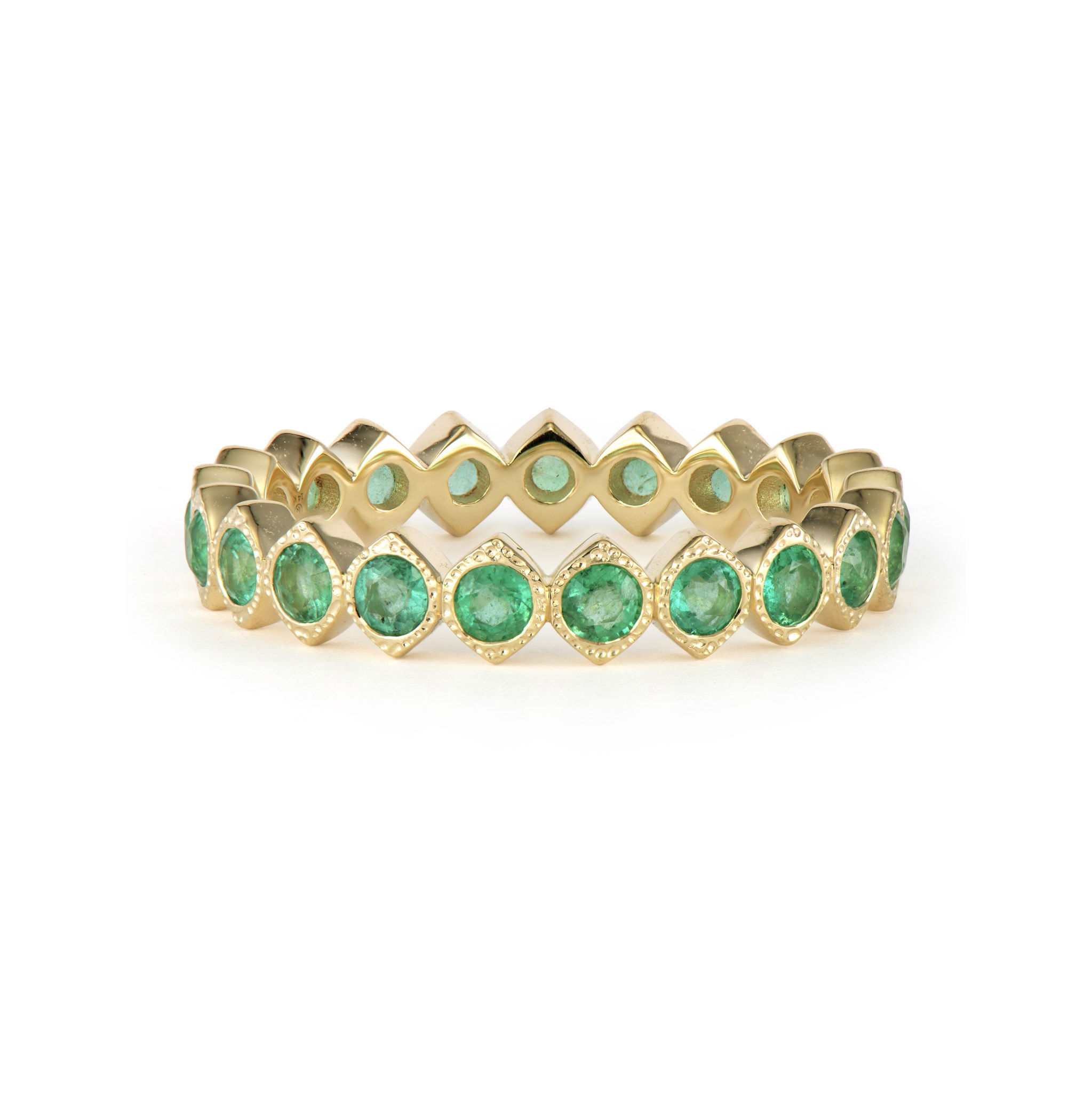 The Narrow Show Your Love Bezel Set Sapphire Band is statement making but perfect to wear everyday. Made from 14k yellow gold and emeralds, this band features round sapphire stones in hammered bezels to make it truly unique. Wear alone or in a Three Stories ring stack. Narrow Show Your Love Bezel Set Emeralds Eternity Band