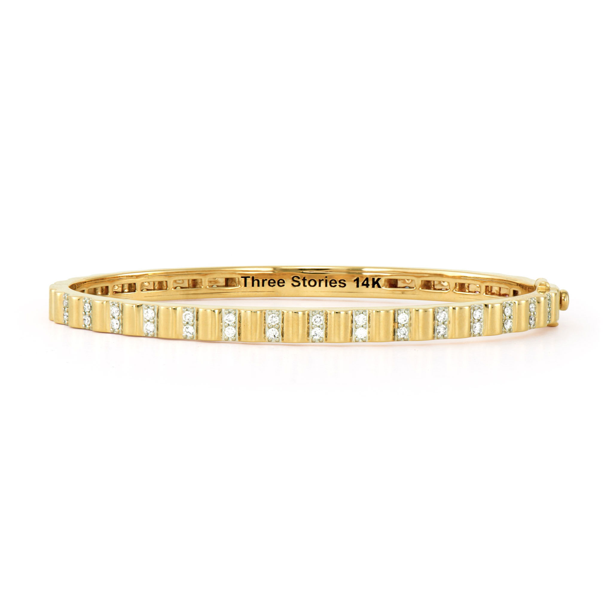 This Rainbow & Diamond Ruffle Bangle combines playful texture with vibrant color. Crafted in 14K gold with a distinctive ruffle motif, it offers two stunning looks in one piece. One side showcases a spectrum of rainbow sapphires that create a colorful dance around your wrist, while the opposite side dazzles with sparkling diamonds. The textured ruffle design adds dimension and movement to this versatile bangle, making it a standout piece in your jewelry collection. Wear it with the sapphire side facing out for a pop of color, or flip to the diamond side for classic elegance. Size 6.5. Rainbow & Diamond Ruffle Bangle