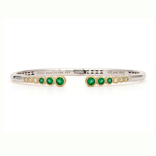 Closeup photo of Classic Two-toned Open Bezel Set Emerald Bangle
