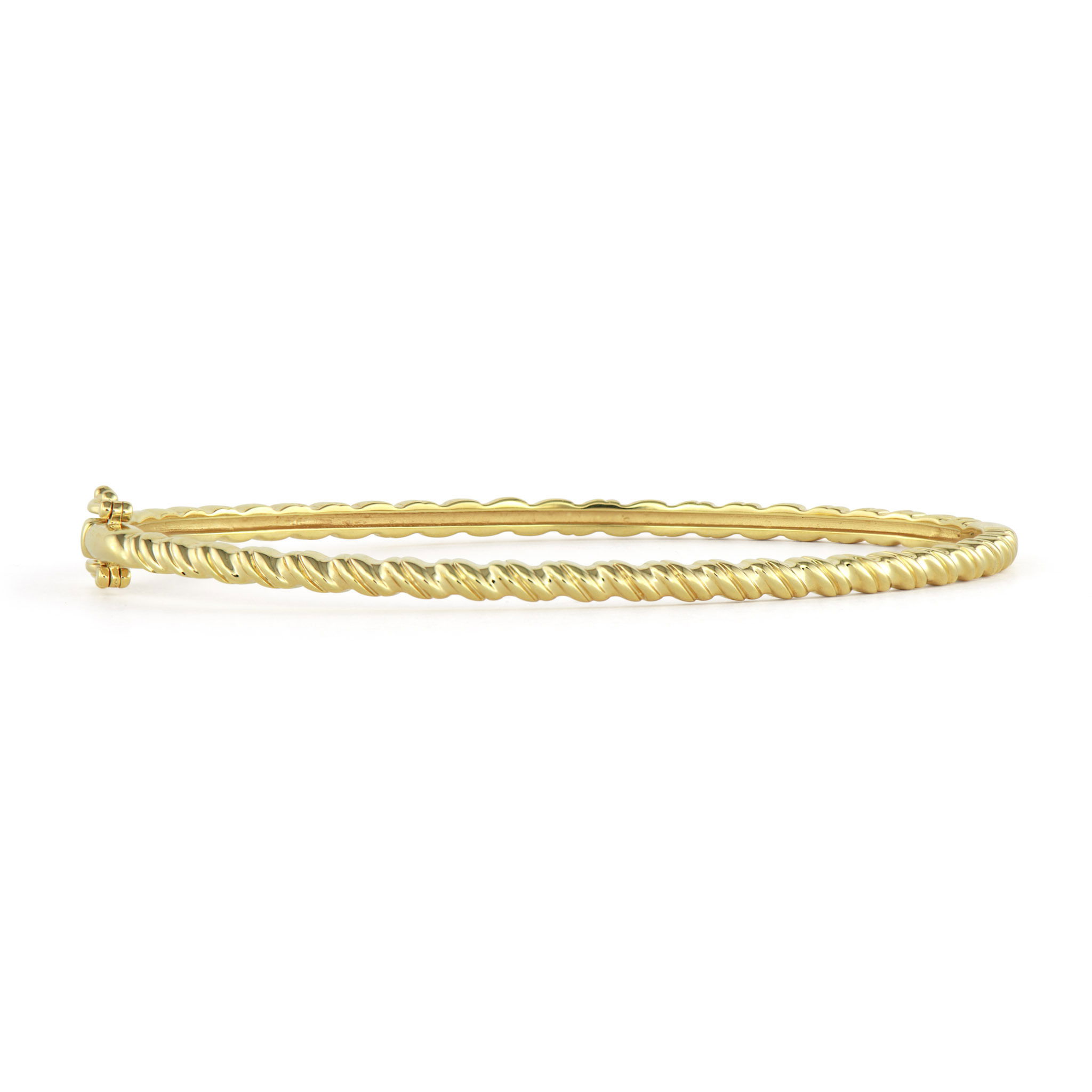 The Narrow Ruffled Diamond Bangle brings texture and sparkle to your wrist in perfect harmony. Crafted in 14K gold, this elegant bangle features a distinctive ruffled pattern that creates beautiful dimension and movement around your wrist. Sparkling diamonds are sprinkled throughout the textured surface, catching the light with every gesture.The narrow profile makes this bangle ideal for stacking or wearing alone, while the ruffled texture adds an artisanal quality that sets it apart from traditional smooth bangles. The randomly placed diamonds create a sense of organic luxury, as if precious gems naturally bloomed within the golden ruffles. Whether worn solo or stacked with other Three Stories bangles, this piece adds sophisticated texture and sparkle to any look Narrow Ruffled Diamond Bangle