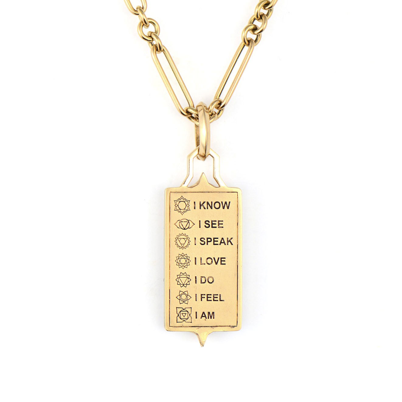 The Be the Light Elongated Tablet Pendant carries profound meaning in elegant form. Crafted in 14K gold, one side features a luminous mother-of-pearl sun surrounded by sparkling diamonds, symbolizing radiance and inner light. Flip it over to discover the deeply personal engraved message: "I know, I see, I speak, I love, I do, I feel, I am" - representing the heart chakras and the journey to self-awareness.This meaningful pendant serves as both beautiful jewelry and a daily reminder of your inner strength and light. The elongated tablet shape creates a sophisticated silhouette while carrying powerful intentions close to your heart. Perfect for those who seek jewelry that inspires and uplifts. Chain sold separately. Be the Light Elongated Tablet Pendant