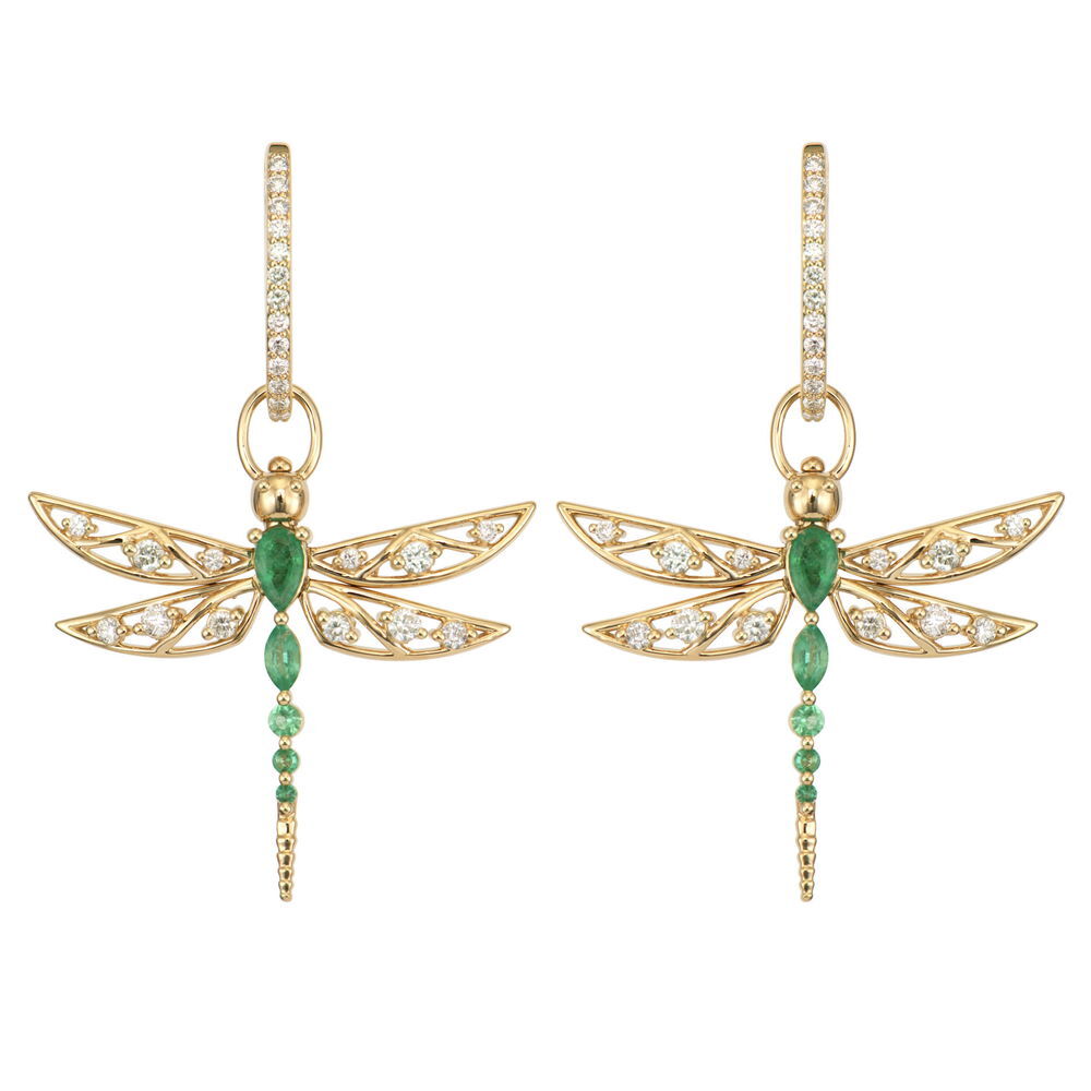 This Large Dragon Fly Emerald Top Switch Charm captures the delicate beauty of nature in luxurious form. Crafted with intricate detail, the dragonfly features vibrant emeralds and sparkling diamonds that bring its wings and body to life, all set in 14K yellow gold. What makes this charm truly special is that the wings actually move, creating a lifelike flutter effect as you wear it. The innovative Three Stories top switch mechanism allows you to easily transform this charm from a pendant to an earring charm, giving you versatility in how you wear it. When worn as an earring, the dragonfly appears to hover gracefully next to your ear, while as a pendant, it makes a striking statement piece. This sparkling gold charm can be worn on Three Stories hoop earrings or added to a chain bracelet or necklace. Perfect for nature lovers or those who appreciate unique, conversation-starting pieces. Hoops and charms sold separately. Large Dragon Fly Emerald Top Switch Charm