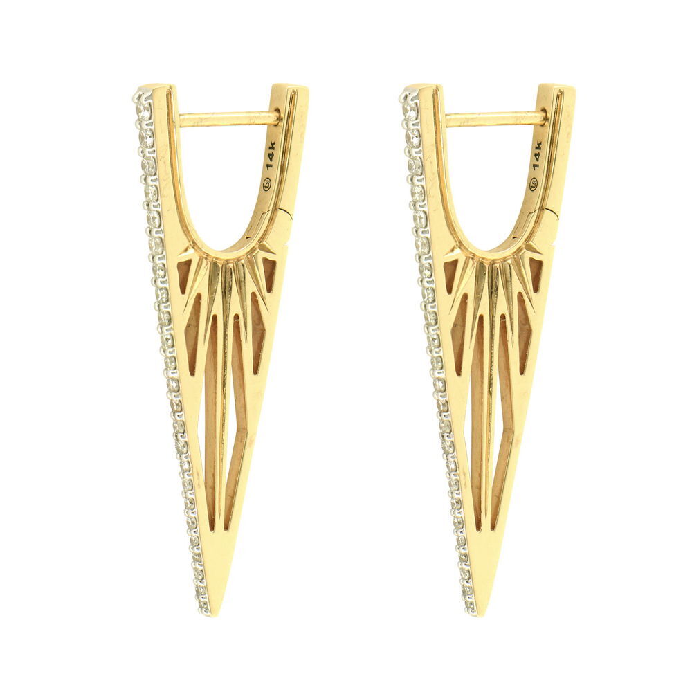 The Cutout Elongated Diamond "V" Hoop Earrings offer a fresh take on the classic design. Crafted in 14K gold and adorned with sparkling diamonds, these hoops feature the same striking elongated "V" shape but with precision laser cutouts along the sides. The geometric cutouts create visual interest and a lighter weight feel.The interplay between solid gold, brilliant diamonds, and open negative space creates a modern, architectural aesthetic that catches the light from multiple angles. These sophisticated hoops prove that bold design can be both striking and comfortable. Hoops sold as singles. Cutout Elongated Diamond "V" Hoop Earrings