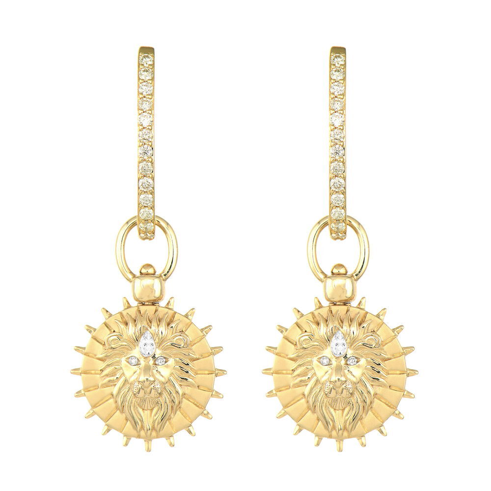 The Lion Heart Sun Medallion Top Switch Charm from the Stories of Animal Archetypes collection combines two powerful symbols in one meaningful piece. Crafted in 14K gold and adorned with sparkling diamonds, one side features a majestic lion representing courage and strength, while the other showcases a radiant sun symbolizing vitality and enlightenment.The innovative Three Stories top switch mechanism allows you to easily transform this charm from a pendant to an earring charm, giving you versatile styling options. Whether you're channeling the lion's brave heart or the sun's warming energy, this medallion brings ancient symbolism and modern luxury together. This sparkling gold charm can be worn on Three Stories hoop earrings or added to a chain bracelet or necklace. Charms sold as singles. Hoops and charms sold separately. Lion Heart Sun Medallion Top Switch Charm