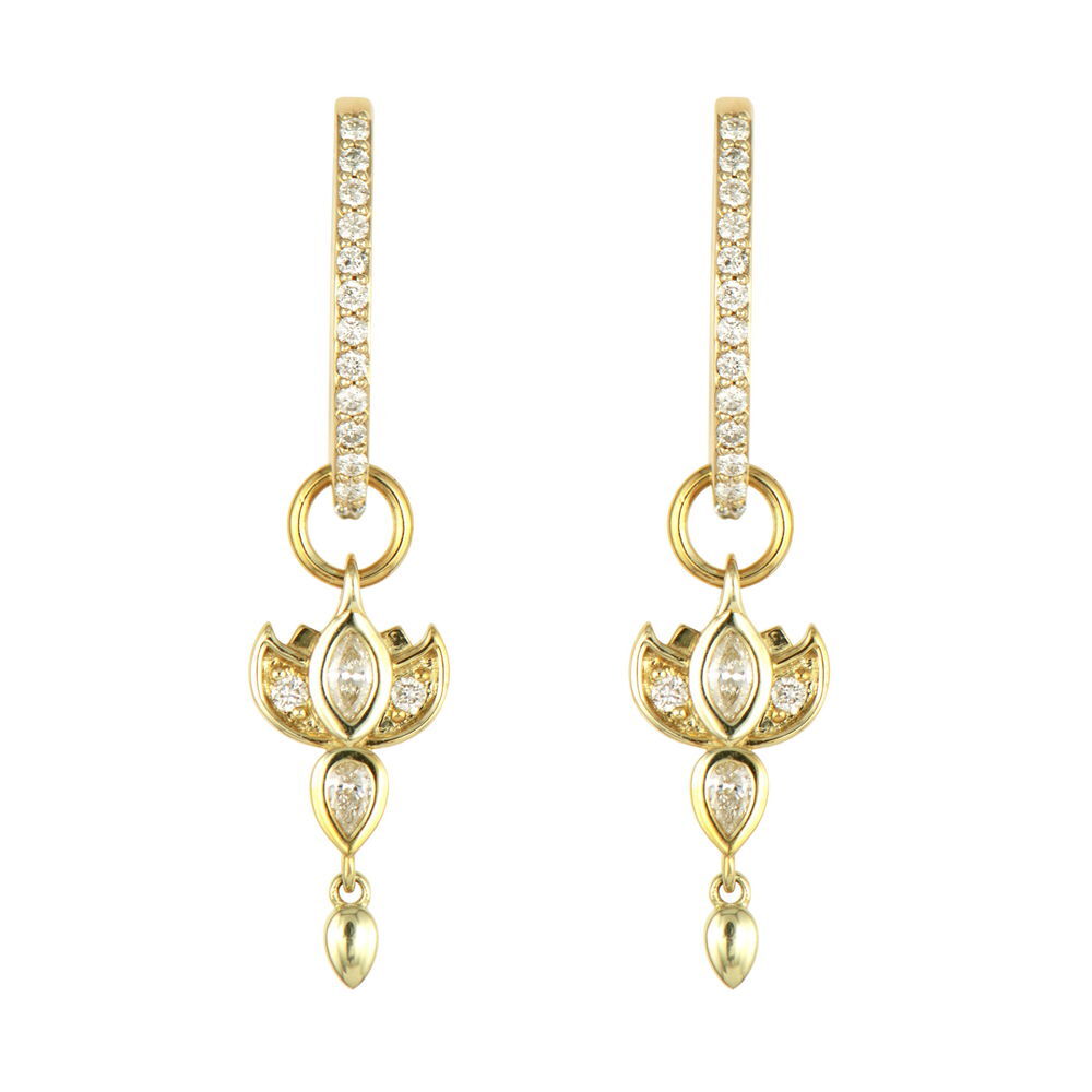 This Diamond Lotus Flower Charm Earring showcases the sacred bloom in exquisite detail, crafted in 14K yellow gold and adorned with sparkling diamonds. The lotus petals are meticulously designed to capture the flower's natural elegance, while the diamonds add a touch of luminous brilliance to each curve. Symbolizing purity and spiritual awakening, this charm brings meaning as well as beauty to your collection. This sparkling gold charm can be worn on Three Stories hoop earrings or added to a chain bracelet or necklace by adding an openable pendant bale. Hoops and charms sold separately. Diamond Lotus Flower Charm