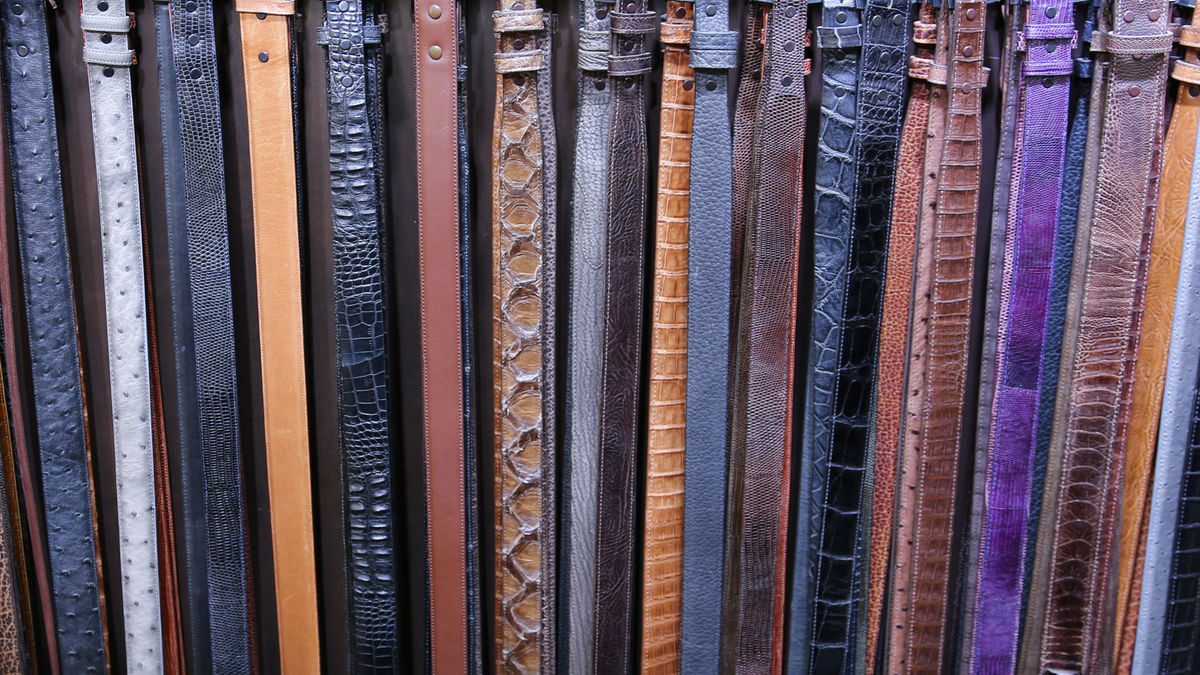 A wall of exotic leather belts