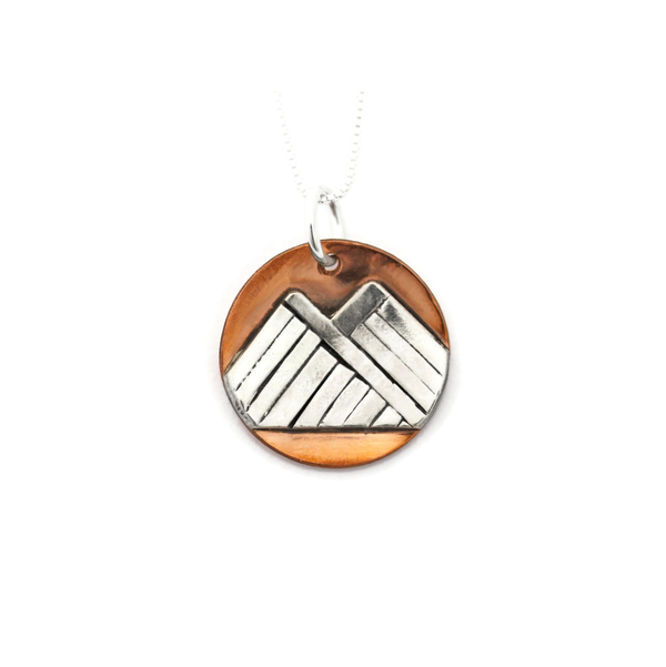 Closeup photo of Handmade Mountain Circle Mini Copper and Sterling Silver Pendant