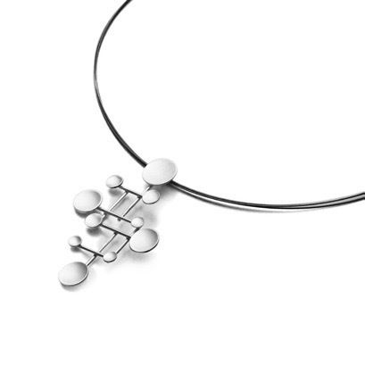 Alexander Calder was an American artist known for his innovative and geometrical mobiles. Here we have a pendant reminiscent of his style and equally beautiful. Pendant is 2 1/2” h x 1 1/2”, includes a 18” sterling silver snake chain. Disk Calder Sandblasted Sterling Silver Pendant