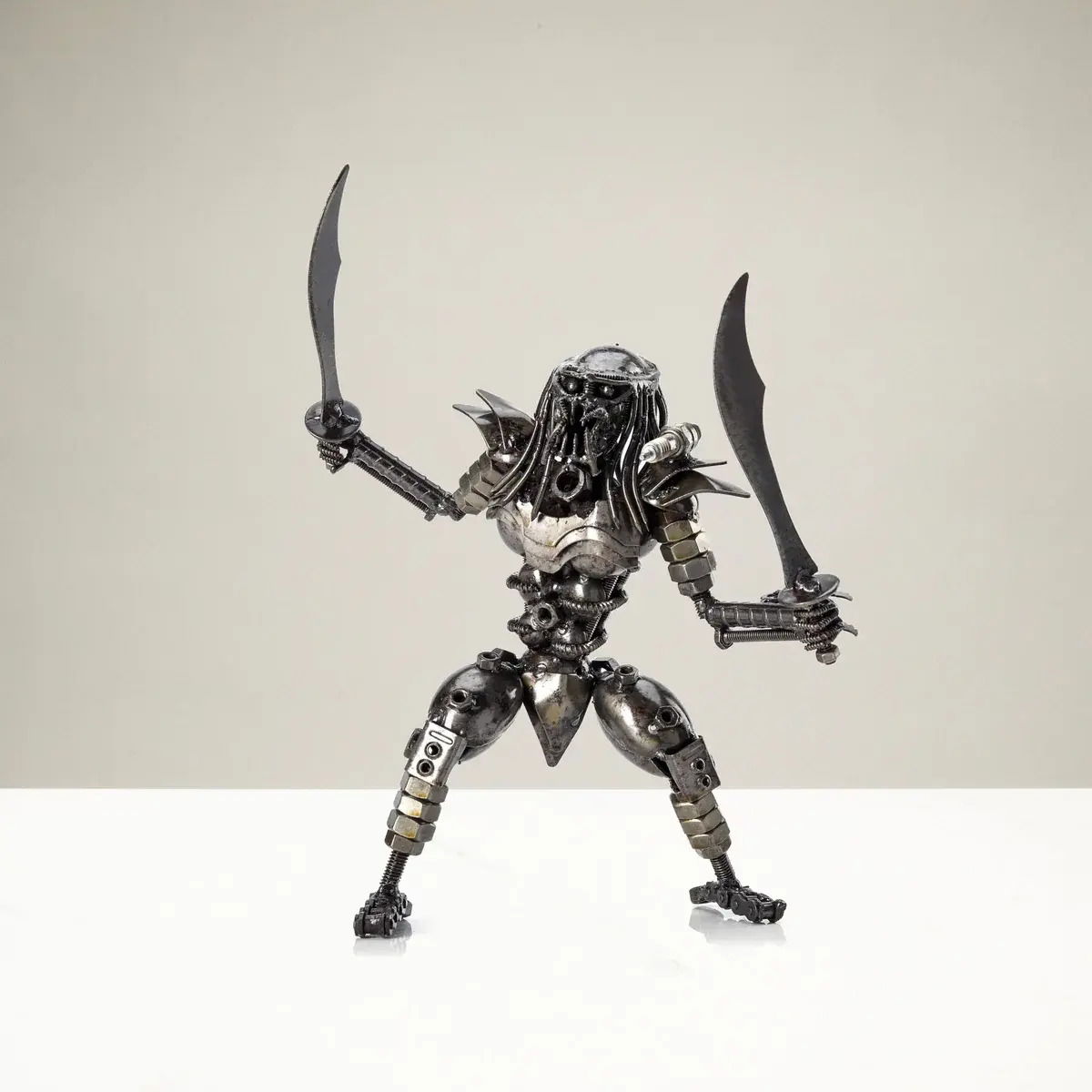 Predator with Dual Wielded Sword Inspired Recycled Metal Sculpture