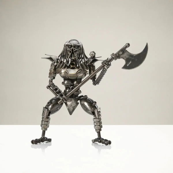 Closeup photo of Predator with Battle Axe Inspired Recycled Metal Sculpture