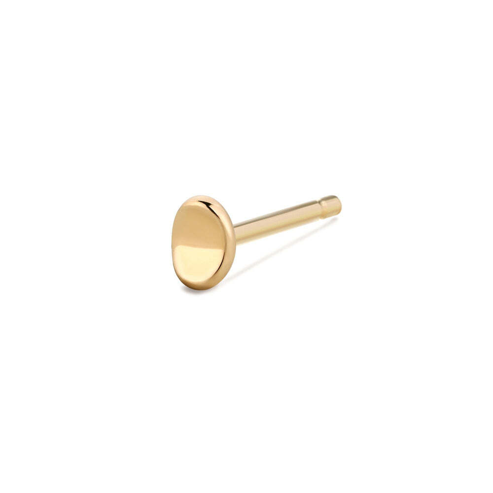 A modern curvy circle stud is a fun update to the classic design. Our Lois Single Curved Dot Stud is the perfect, minimal addition to your ear game. Material: 14K Solid GoldSize: 3.5*2.4mmSold Individually LOIS | Single Curved Dot Stud