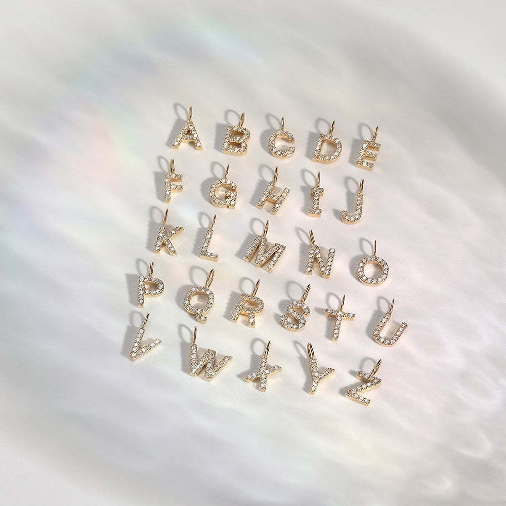 The Diamond Initial Charm, will add a touch of sparkle to your look. Each design is dainty, modern and playful. You’ll have so much fun personalizing, styling, stacking and showing off each piece.Material: 14K Solid GoldLetter Dimension: 6.2mm*8mmRing Diameter: 4mm*2.6mmStone Type: DiamondTotal Carat Weight: 0.105ct W | Diamond Initial Charm