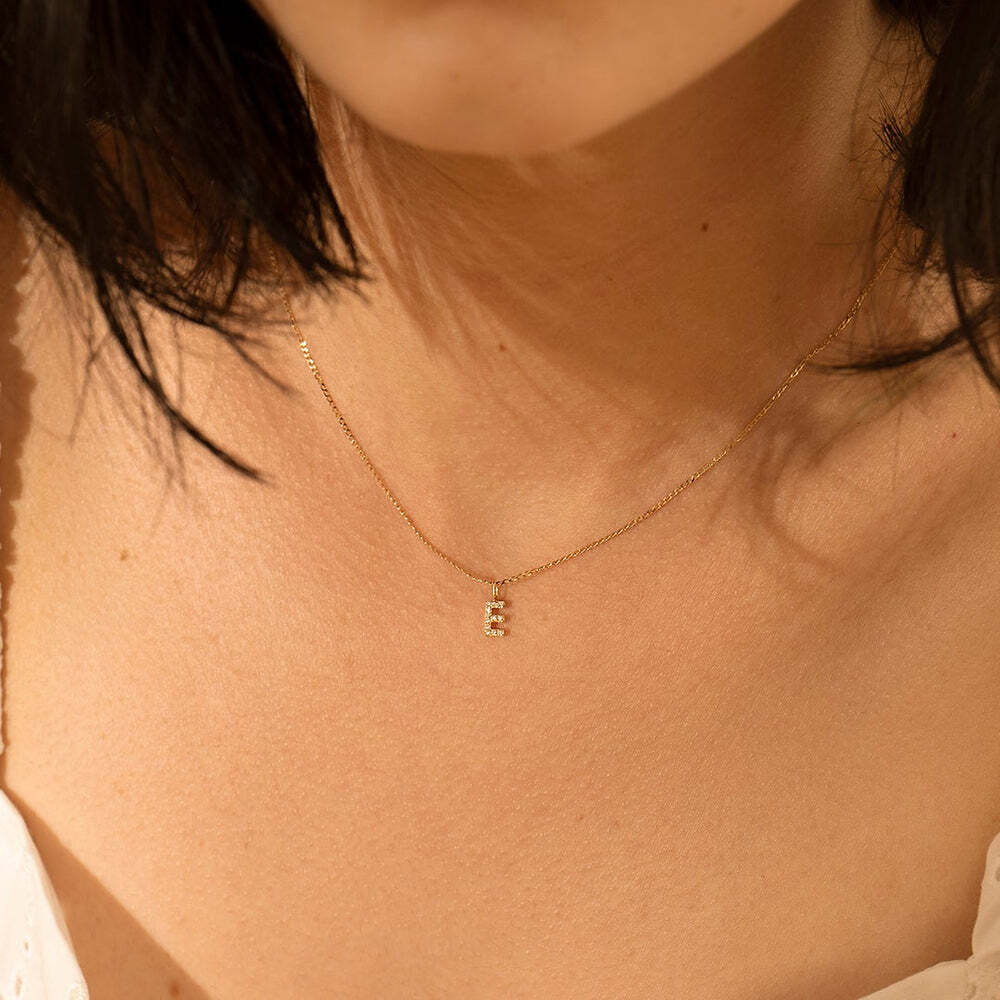 The Diamond Initial Charm, will add a touch of sparkle to your look. Each design is dainty, modern and playful. You’ll have so much fun personalizing, styling, stacking and showing off each piece.Material: 14K Solid GoldLetter Dimension: 6mm*3.4mmRing Diameter: 4mm*2.6mmStone Type: DiamondTotal Carat Weight: 0.06ct E | Diamond Initial Charm